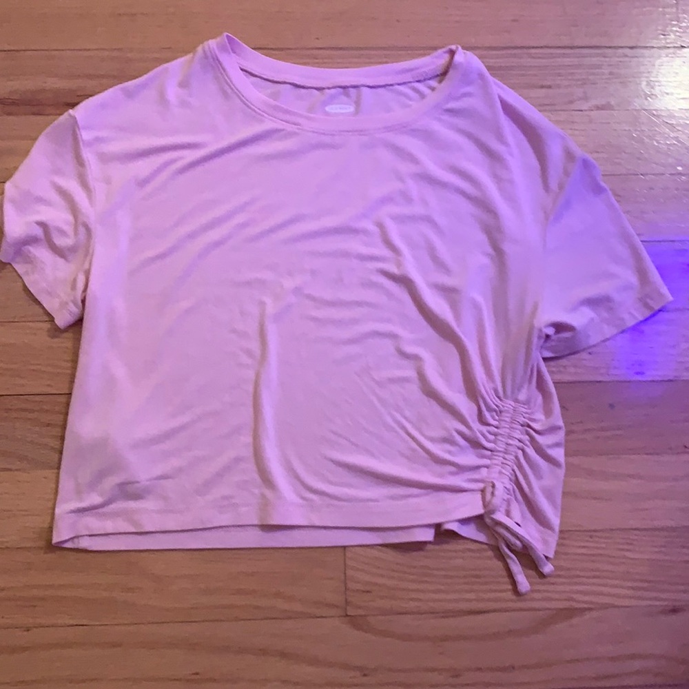 Cute pink t-shirt and scrunched on left side.